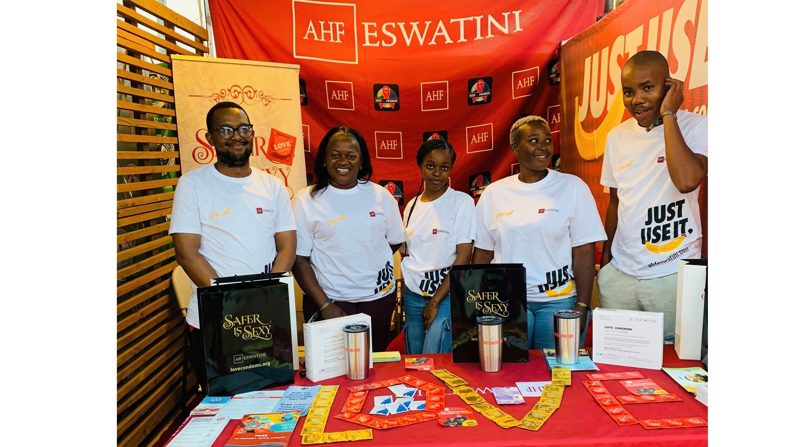 Empowering through education – AHF Eswatini team members host an awareness booth filled with free resources, condoms and youth-friendly information. (Courtesy pic)